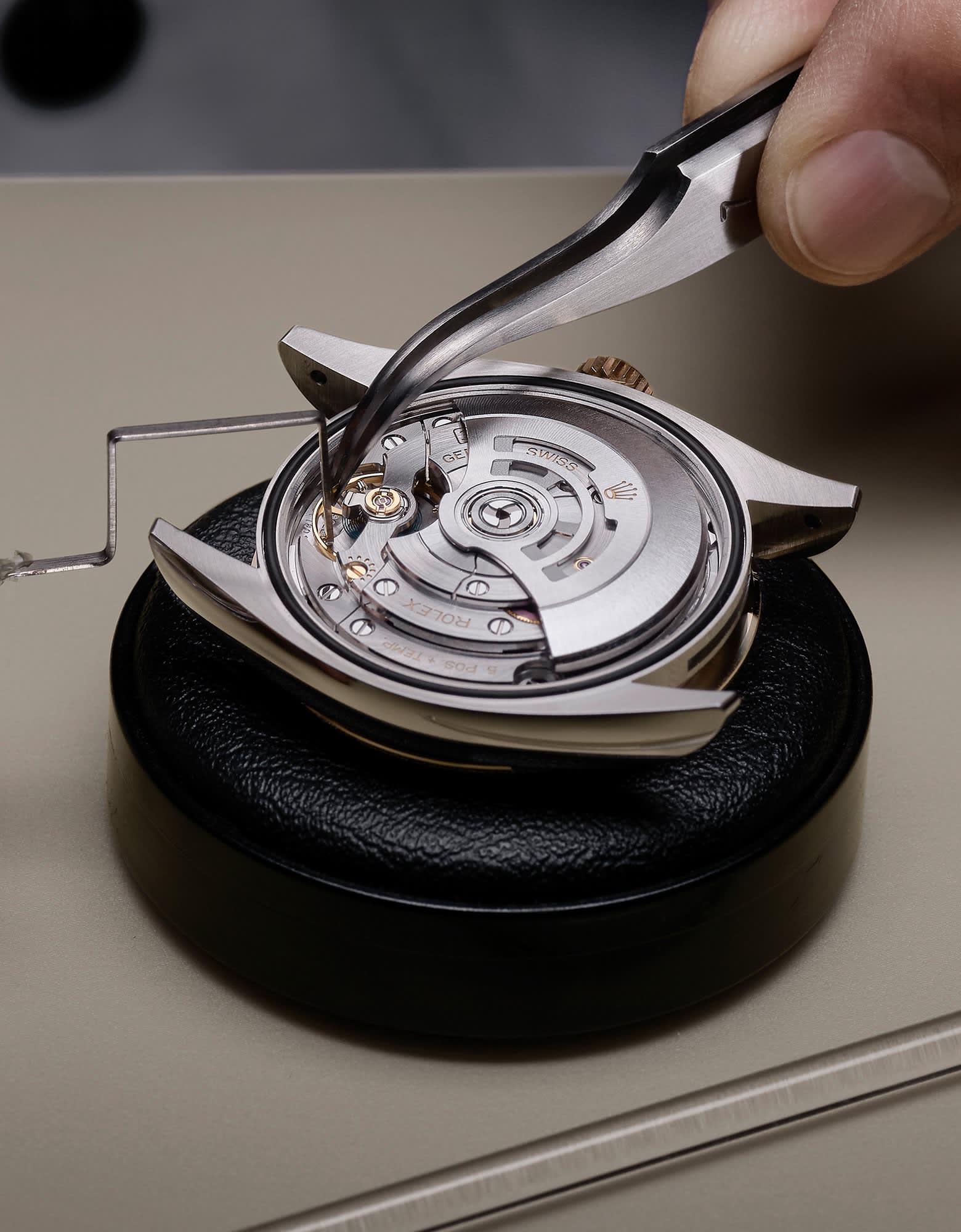 Watchmaker assembling a mechanical watch